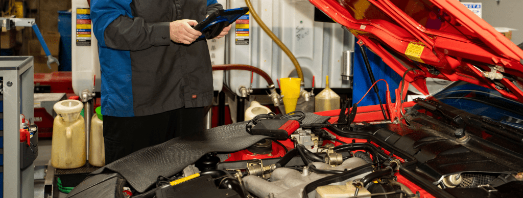 Digital Vehicle Inspections in Franklin, MA by Advanced European Repair. Image of a technician using a tablet to perform a vehicle diagnostic test, highlighting the shop’s commitment to precision, performance, and accurate problem-solving for European vehicles.