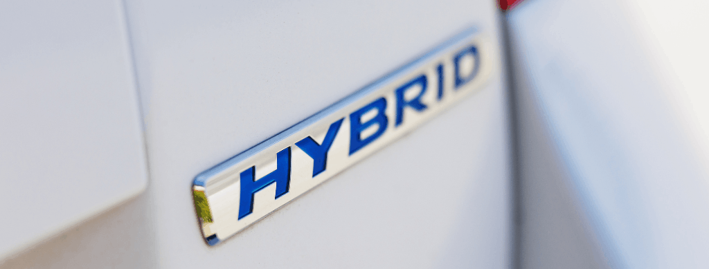 Hybrid and high-voltage repair, auto repair in Franklin, MA, at Advanced European Repair. Image of a close-up of a hybrid vehicle badge, representing professional hybrid and high-voltage vehicle diagnostics, maintenance, and repair services.