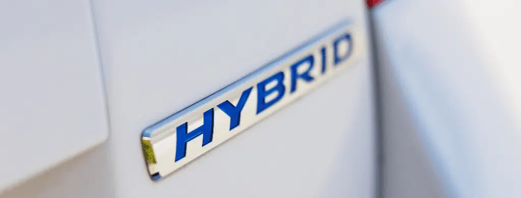 Hybrid and high-voltage repair, auto repair in Franklin, MA, at Advanced European Repair. Image of a close-up of a hybrid vehicle badge, representing professional hybrid and high-voltage vehicle diagnostics, maintenance, and repair services.
