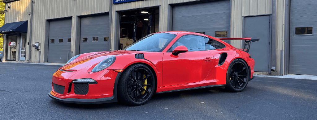 European auto repair in Franklin, MA, at Advanced European Repair. Image of a Porsche 911 GT3 parked outside the shop, showcasing expert European auto repair and maintenance focused on preserving peak performance, precision, and driving safety.
