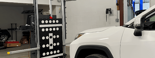 ADAS calibration in Franklin, MA, at Advanced European Repair. Image of a vehicle positioned with ADAS calibration equipment for precise sensor alignment, highlighting accurate safety system calibration and reliable vehicle performance.